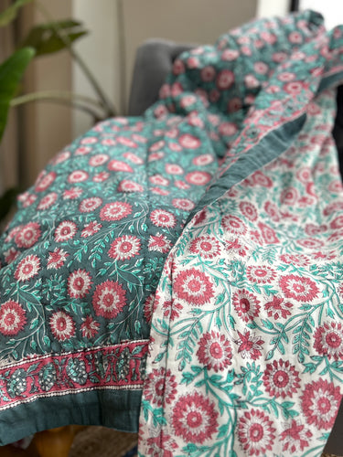 green and pink block print quilt