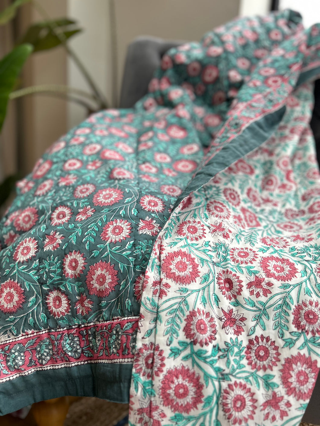 green and pink block print quilt