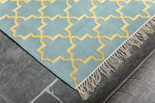 Load image into Gallery viewer, close up detail of blue and gold rug
