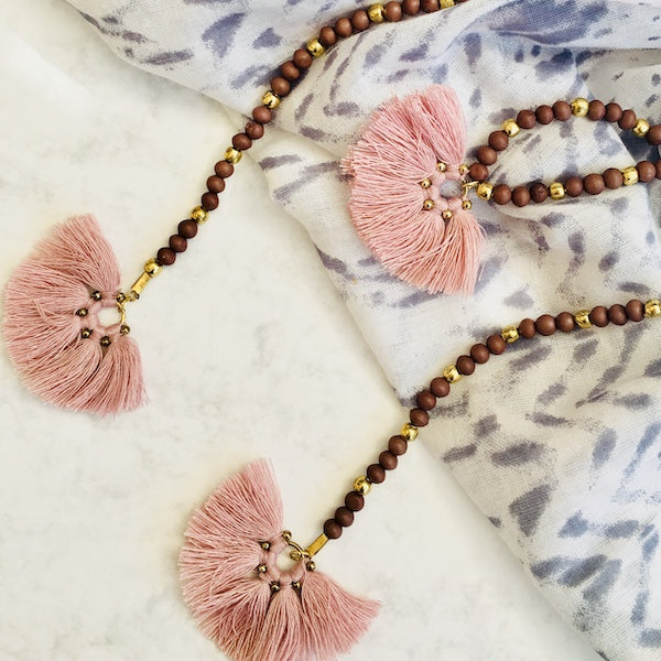 Long pink bead and tassel necklace