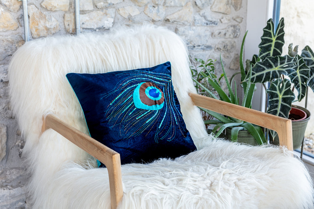 Velvet peacock cushion